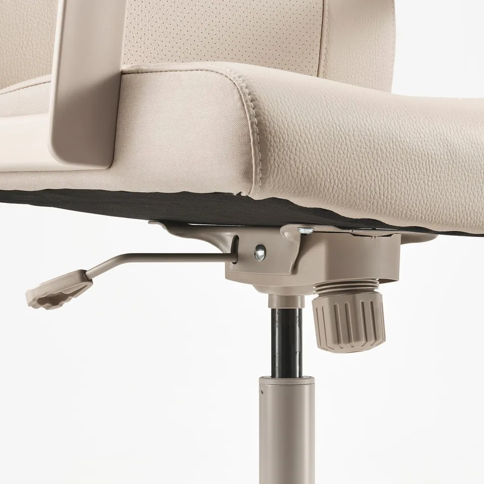 Close-up of MILLBERGET office chairs height adjustment mechanism and safety casters.