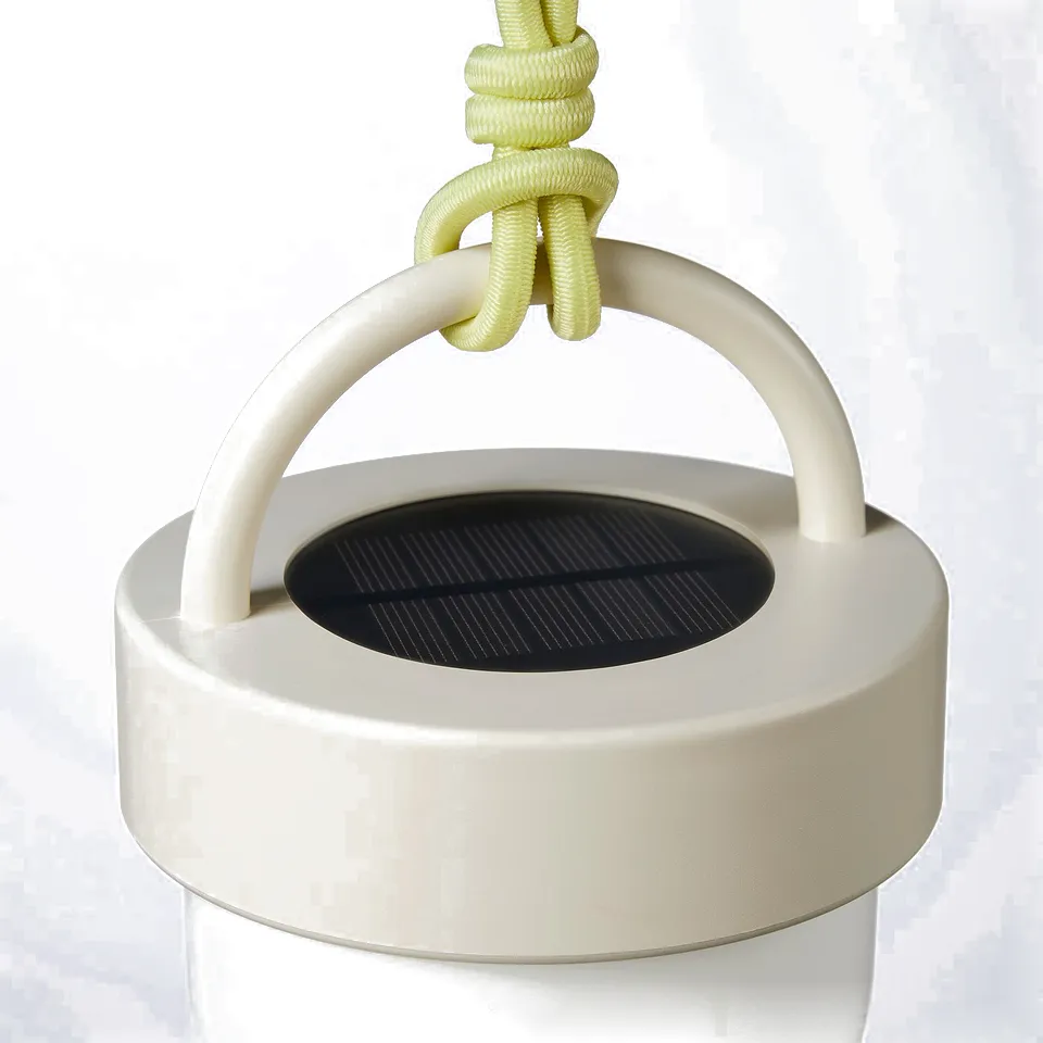 Modern solar lamp with clean lines, featuring a light green rope handle and structured white body, emitting eco-friendly light.