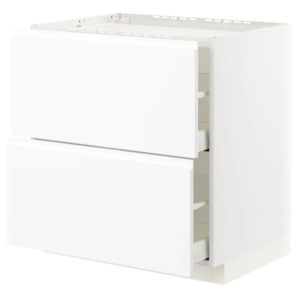 White METOD kitchen unit with minimalist design and integrated handles.