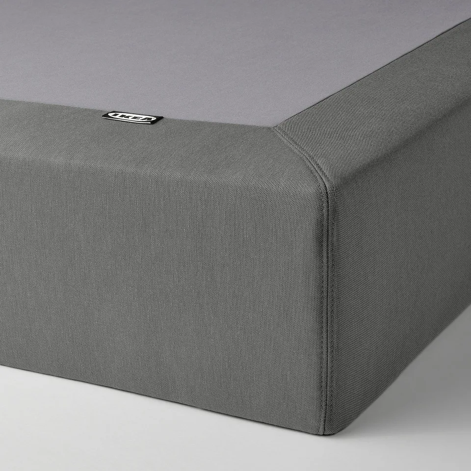 Grey fabric bed base with zip, showing soft and durable cover.