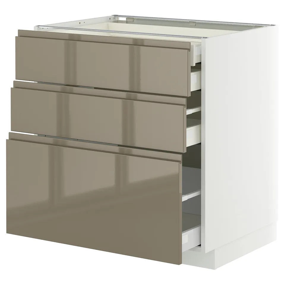 Modern kitchen cabinet: METOD in beige-brown with sleek handles, three drawers and+ white base, glossy finish.