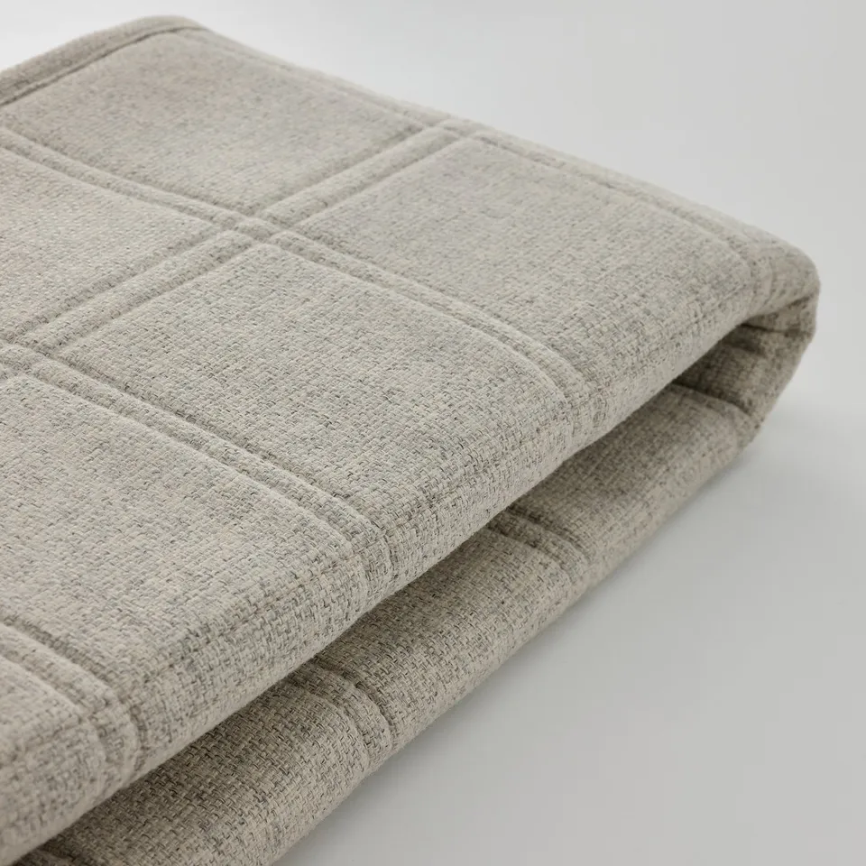 Grey fabric cover, neatly folded, high-quality texture, soft & durable.