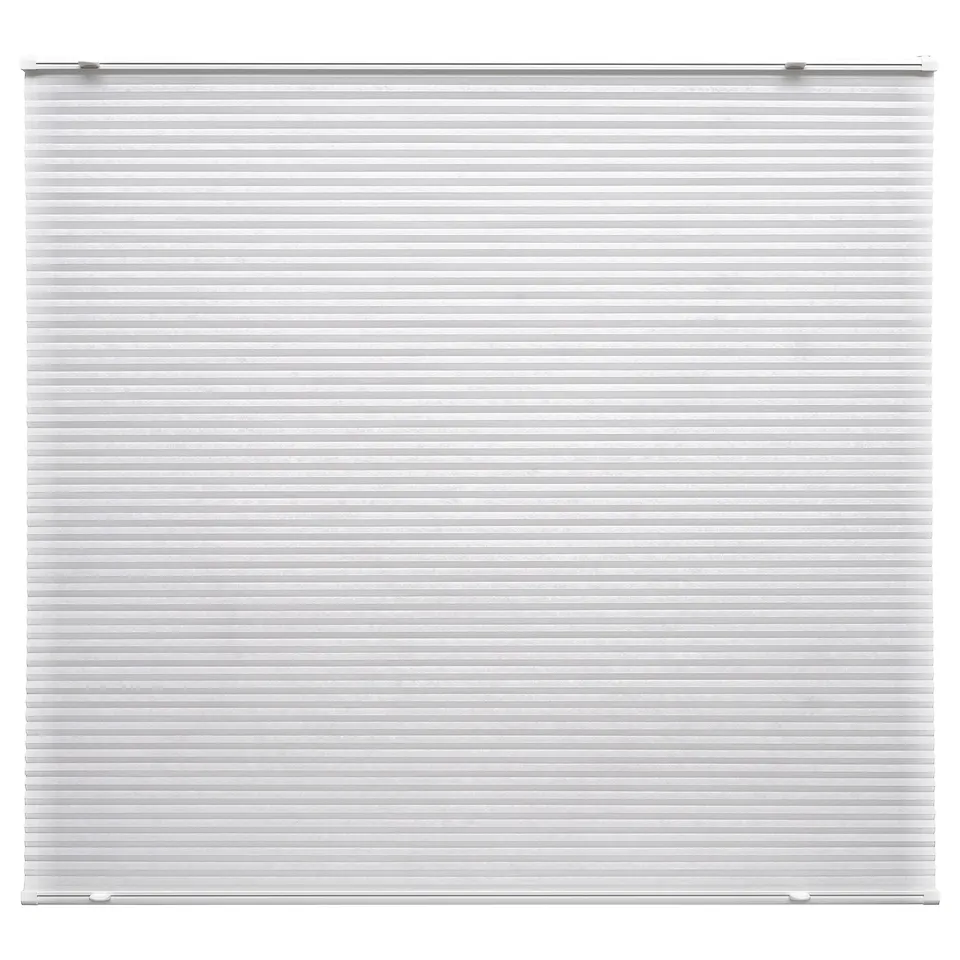 White HORNVALLMO pleated blind, cordless, made of polyester, attached with adhesive brackets.