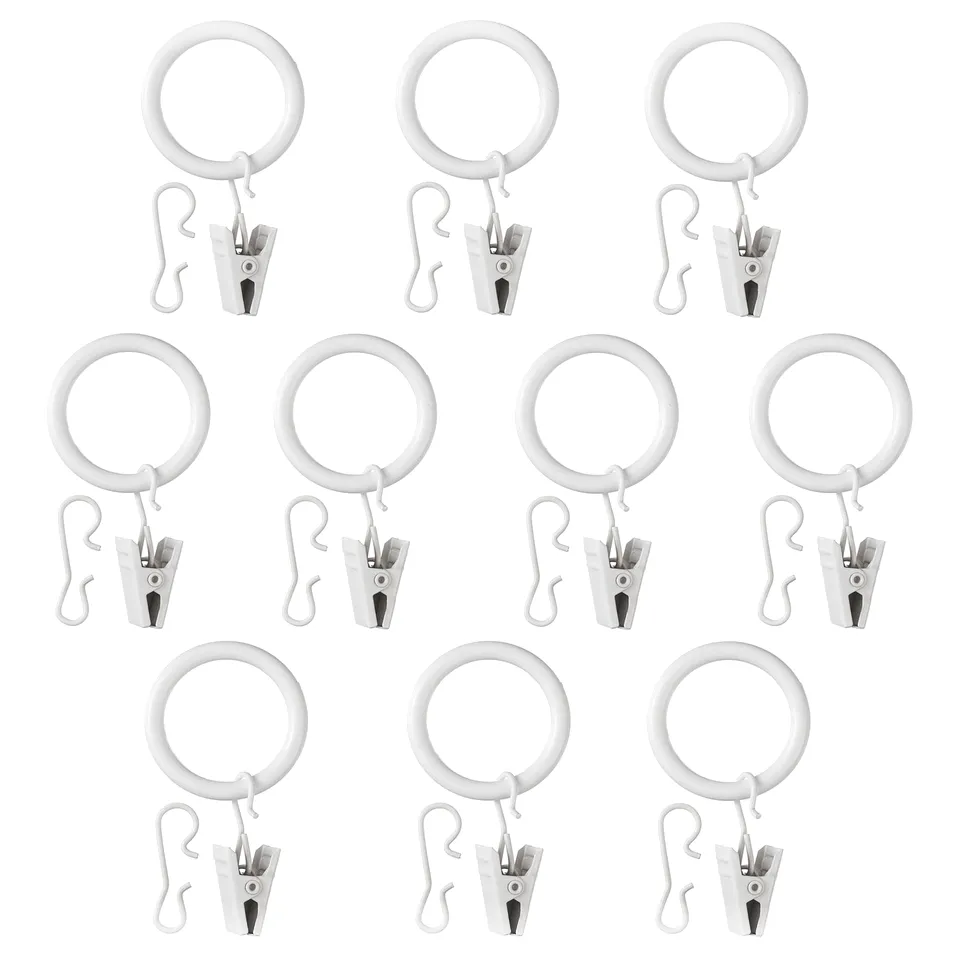 A set of 12 white SYRLIG curtain rings with clips or hooks, made of abs plastic and steel, arranged in a grid.