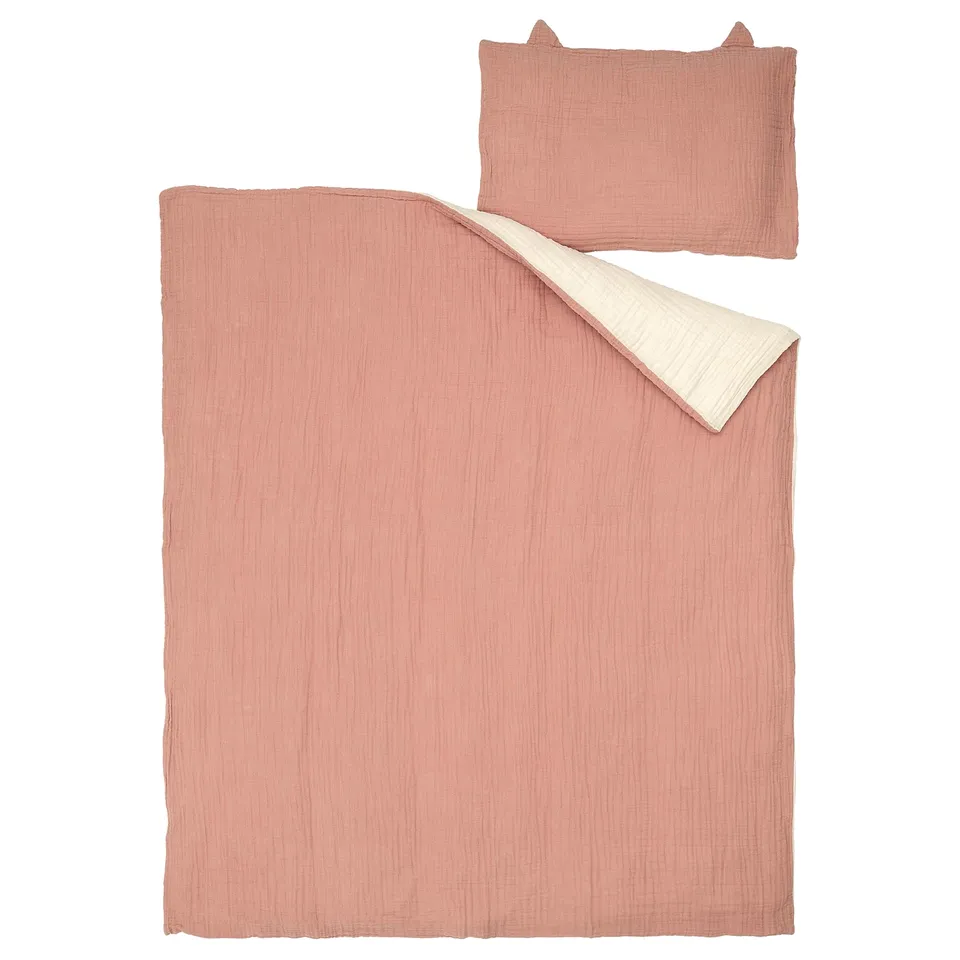 Baby bedding set: pink duvet, matching pillow, organic cotton.