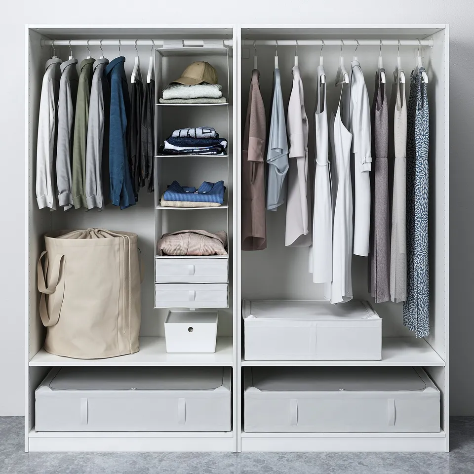 Open closet displaying clothes storage, shelves, and drawers for organised wardrobe.