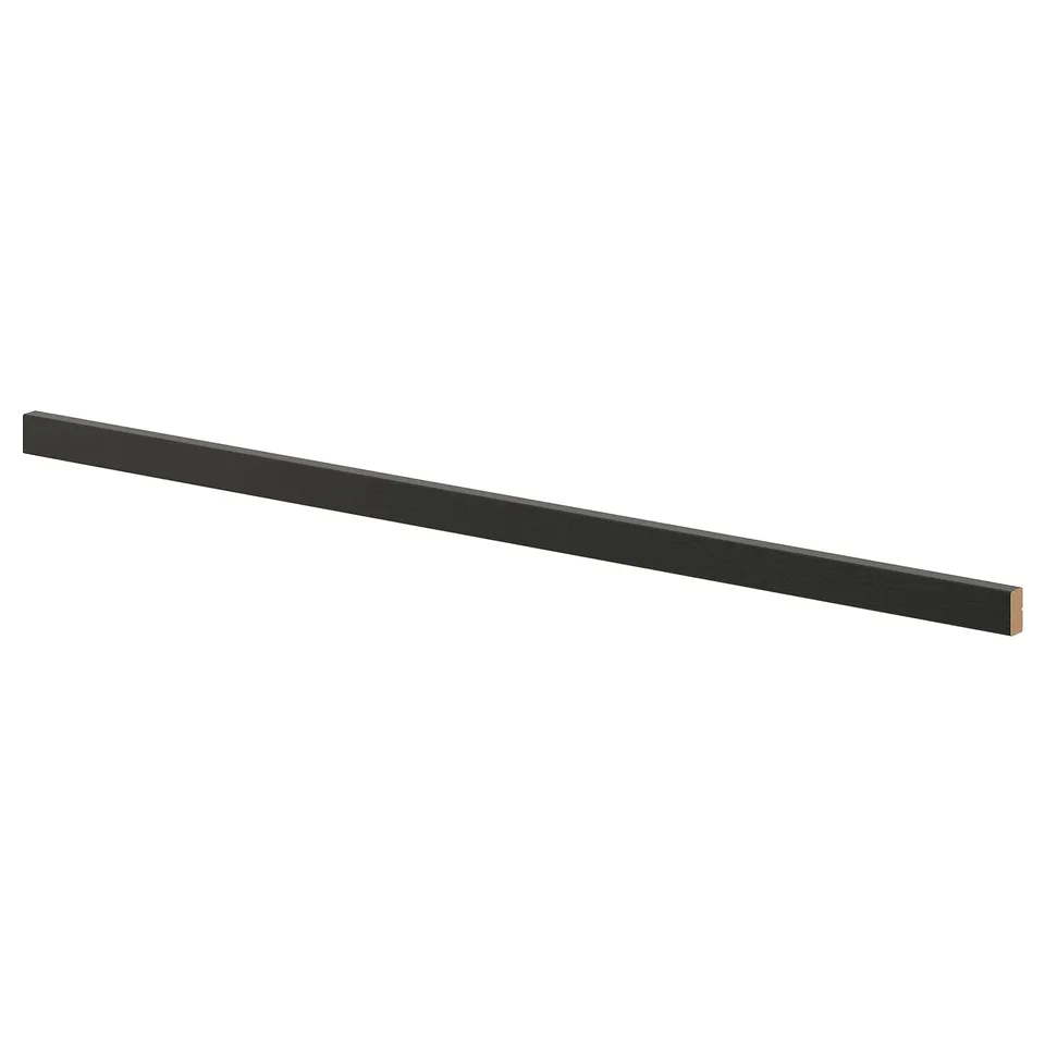 Black wooden LERHYTTAN kitchen plinth, rectangular, with bevelled edges.