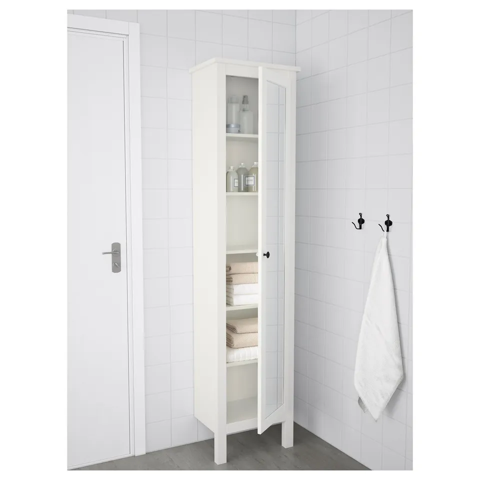 White bathroom cabinet with mirror, displaying interior storage for towels and supplies, featuring adjustable shelves.