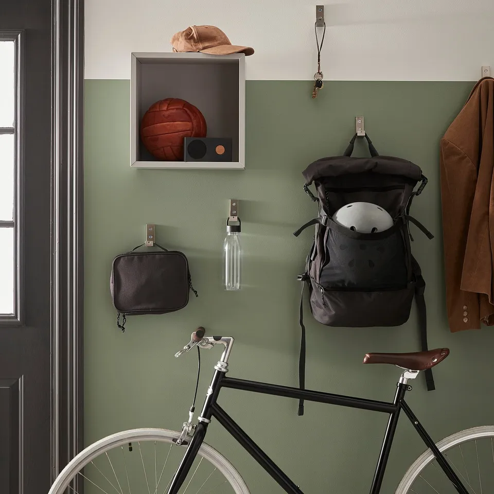 Sports gear wall: basketball, cap, speaker, backpack, helmet, bottle, pouch, bike.