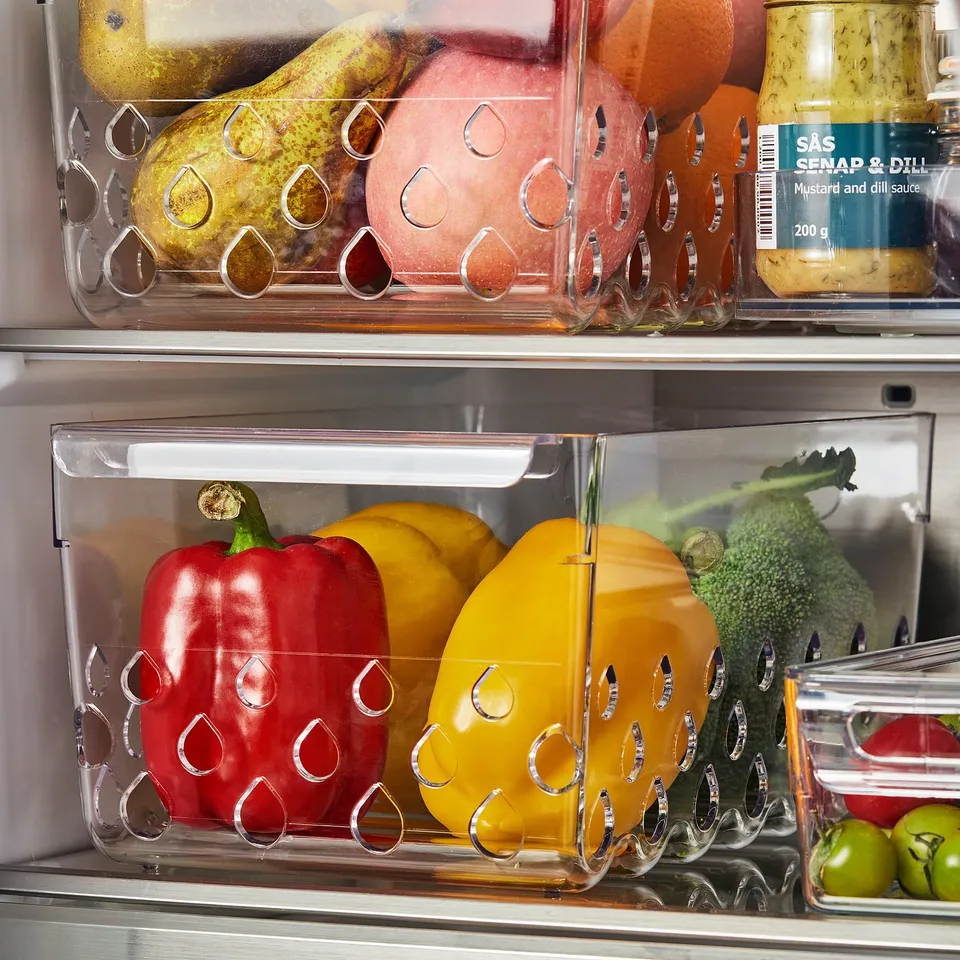 Fridge baskets organise fruits, veggies, with ventilation for freshness.