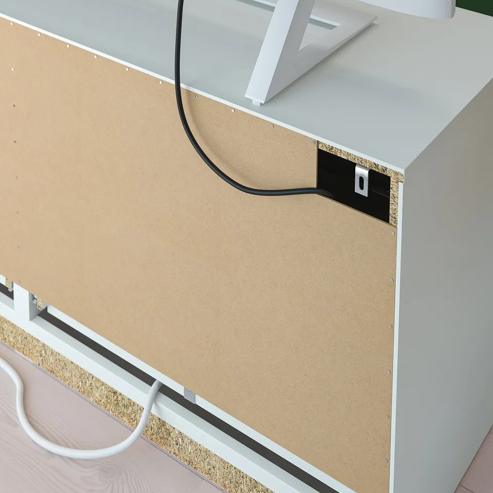 Corkboard with cord access, suitable for organising notes.