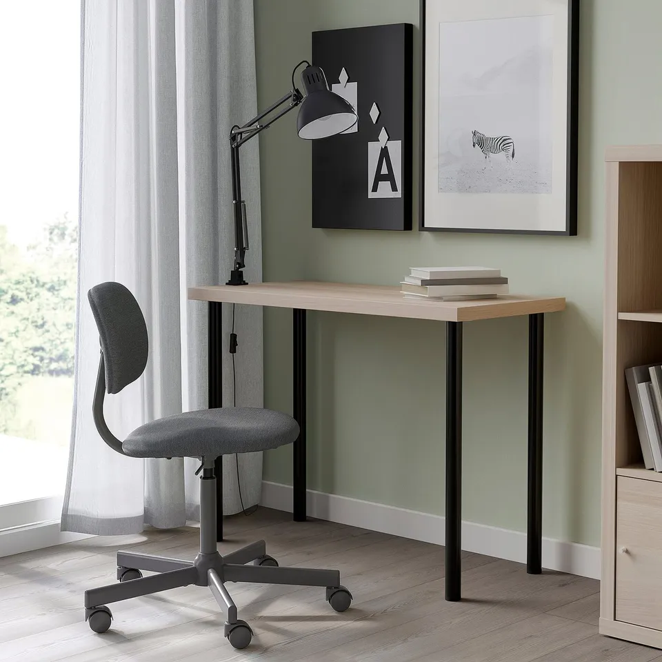 Modern home office with LINNMON desk, grey chair, light decor.