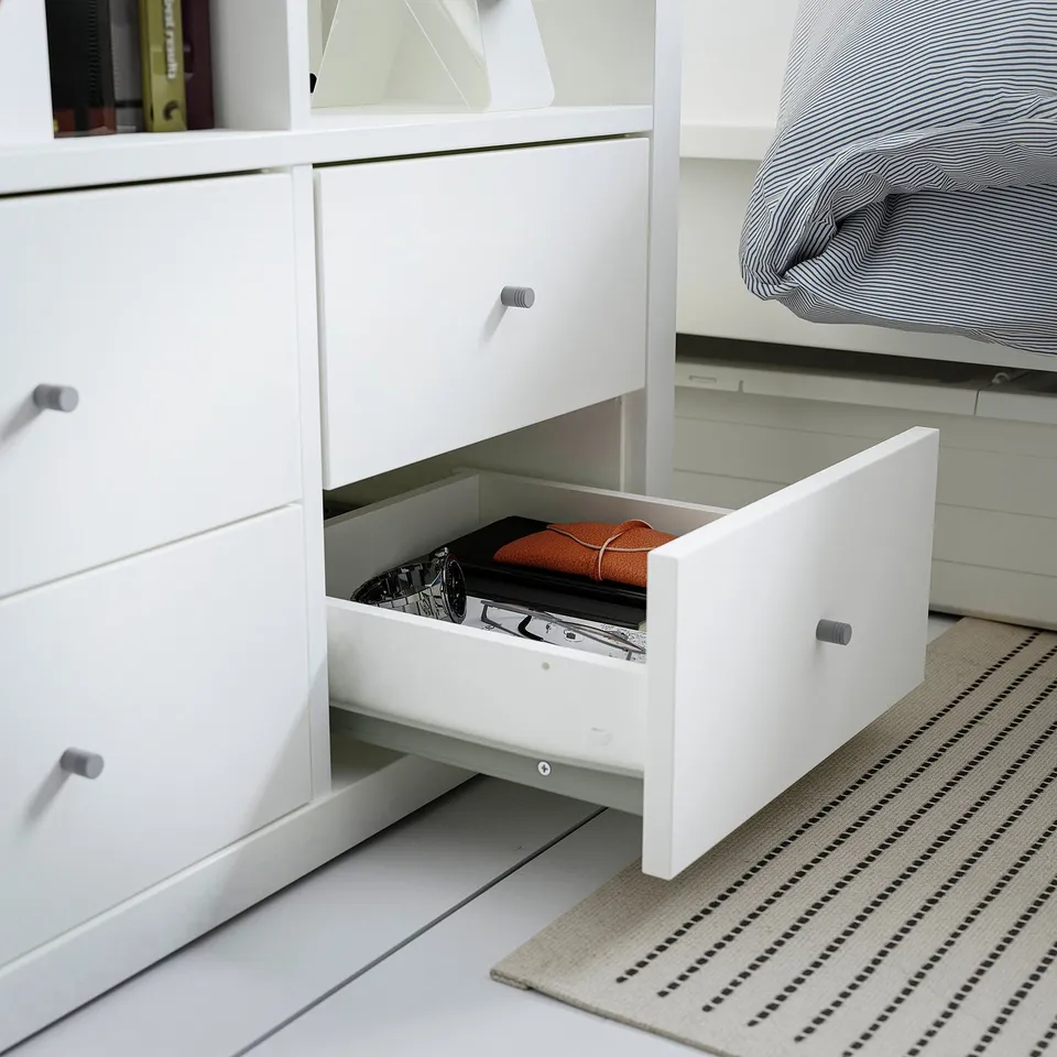 This white KALLAX drawer set offers practical storage, hiding clutter with inserts for a calm, organised space.