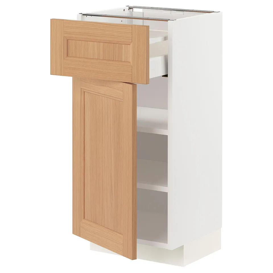 An ikea METOD cabinet with a white frame and vedhamn oak doors, featuring drawers and shelves.