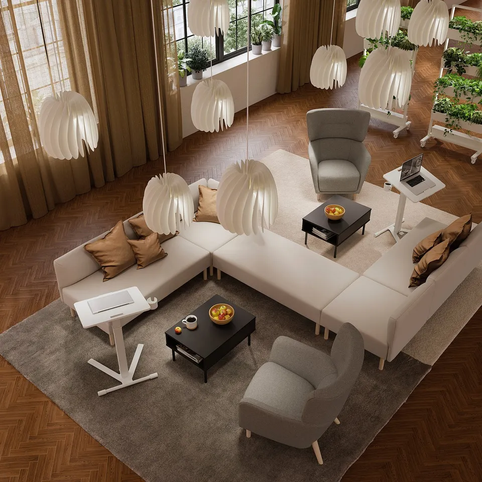Modern lounge with adjustable laptop table, armchair, and sofa. Wood floors, lamps, and large windows.