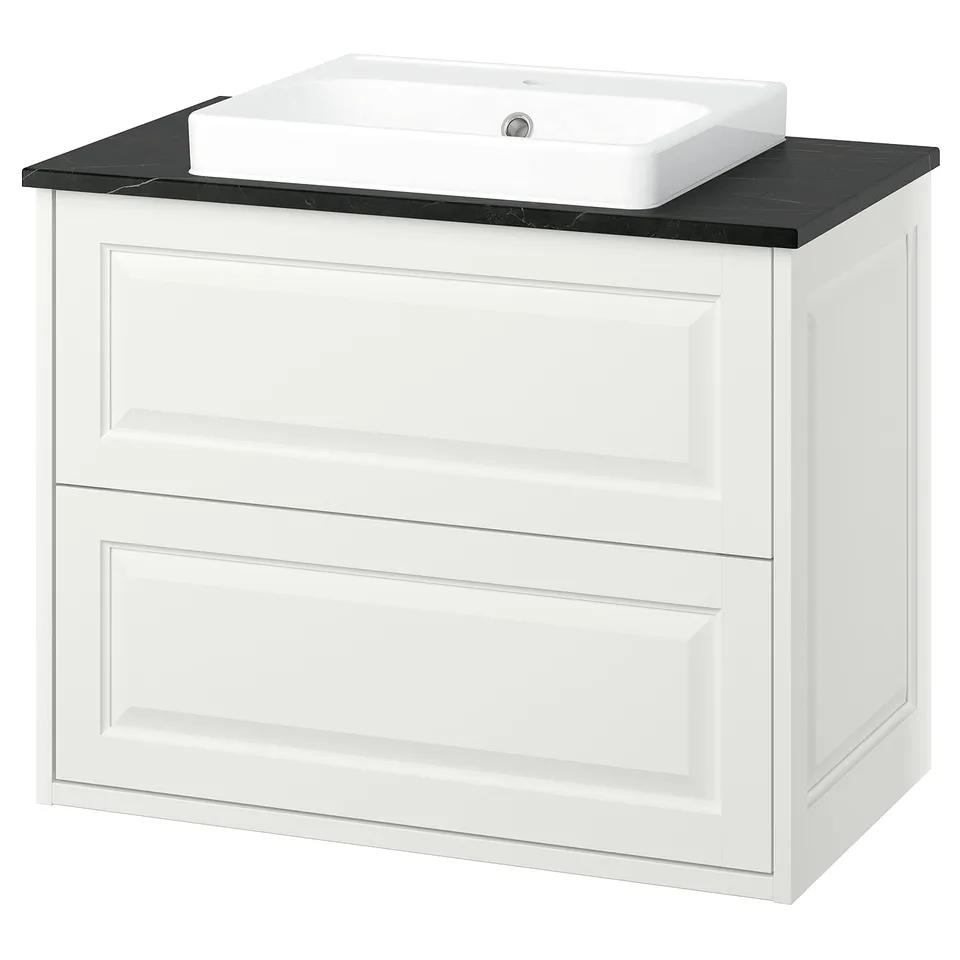 TÄNNFORSEN white bathroom vanity with two drawers, black countertop, rectangular ceramic sink.