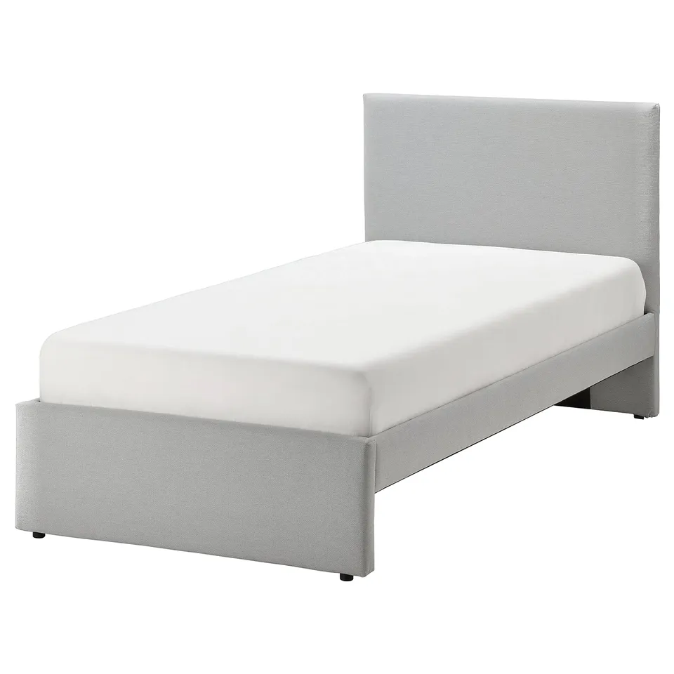Modern grey upholstered bed with rectangular headboard and textured fabric, ideal for contemporary bedrooms.