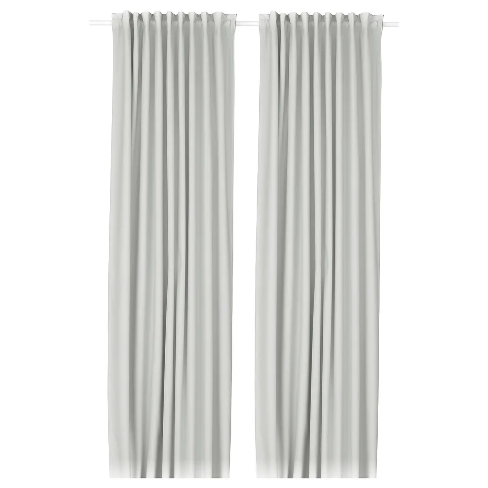 Two light-colored curtains hang side by side, featuring a sleek, smooth design with a textured fabric, and a rod pocket header.