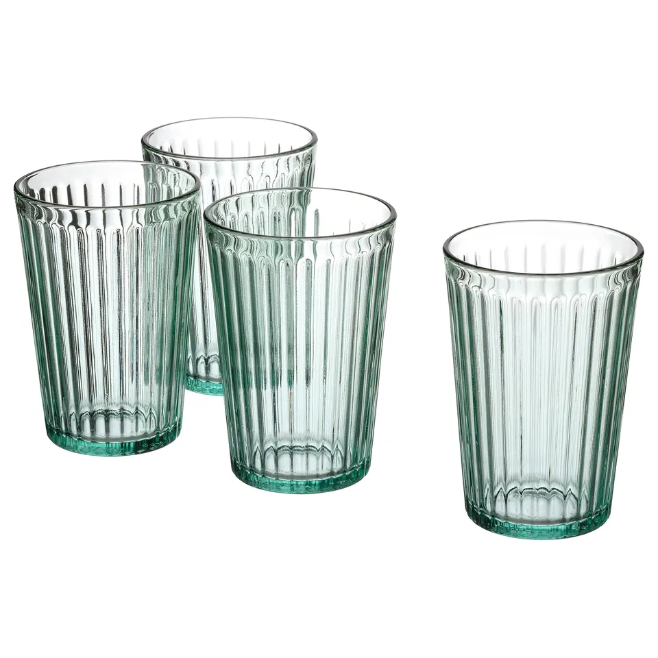 Four clear, green-tinted, ribbed glasses, designed with vertical ridges, made of tempered glass, perfect for serving beverages.