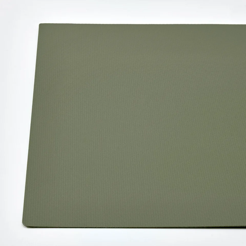Green, non-slip pet mat, rectangular, texture visible, lays flat