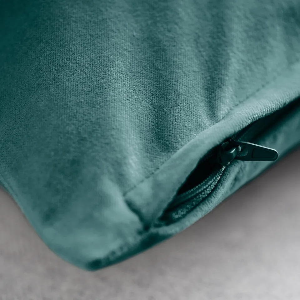 Zippered teal cushion cover in soft cotton velvet.
