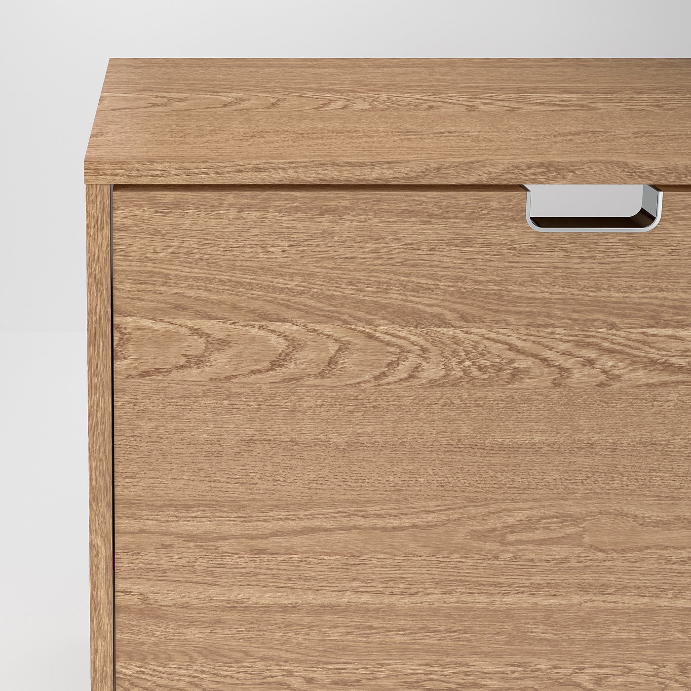 Modern wooden cabinet with metallic handles, smooth finish, light oak grain.