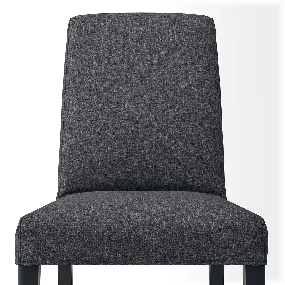 Image depicts a modern, cushioned dining chair in dark fabric. Upholstered for comfort, it a supportive backrest and sturdy wooden legs.