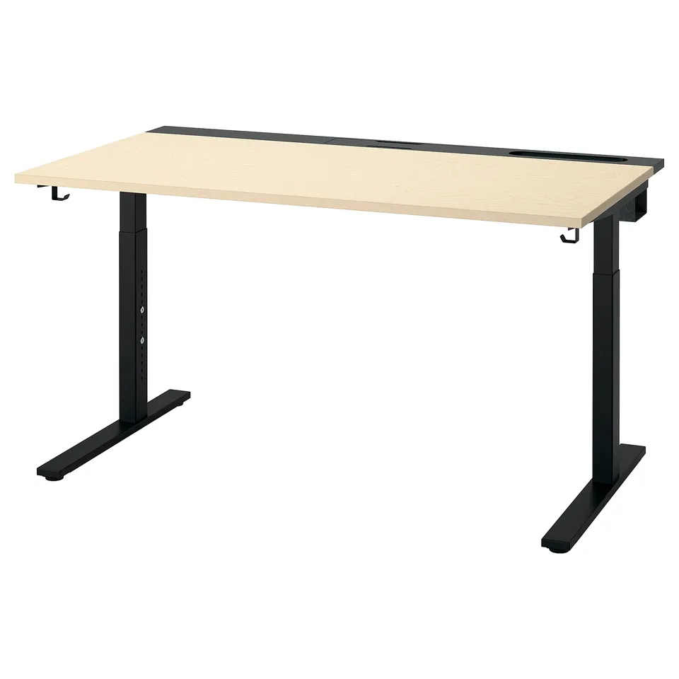 MITTZON desk: light wood top, black metal legs, modern design. Height-adjustable, cable management tray, hooks, and durable finish.
