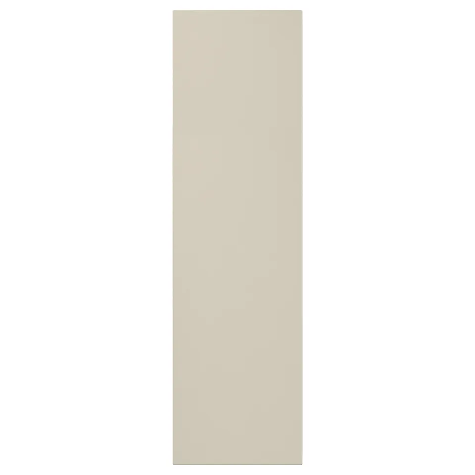 This image a beige HAVSTORP cabinet door with a smooth, rectangular design made from acrylic paint and fiberboard.