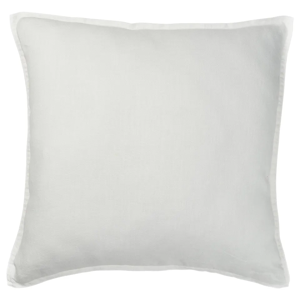 A round, white linen cushion cover with a zip closure. Simple and elegant, perfect for adding a casual touch to home decor.