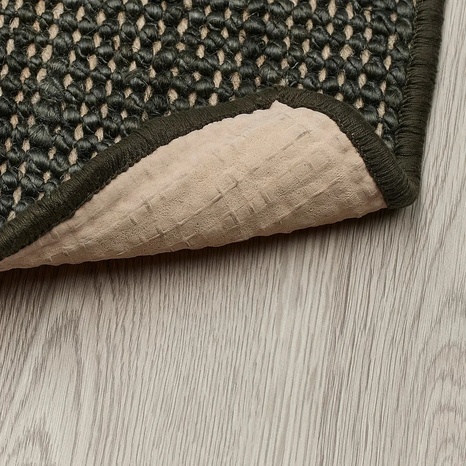 Dark green jute door mat with latex backing, staying in place and trapping dirt.