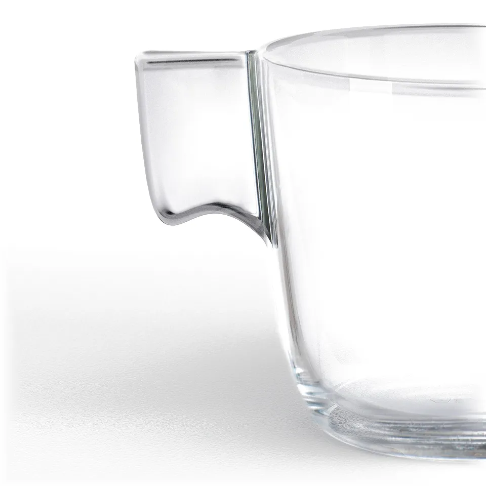 Close-up of a clear glass mug, showcasing its sturdy, seamless handle and transparent body, highlighting its high-quality craftsmanship.