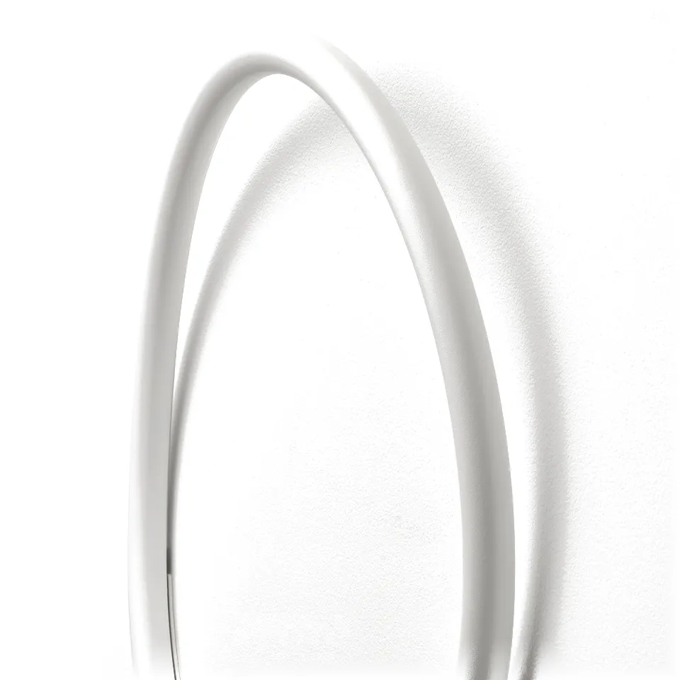 White circular led wall lamp casting soft light, mounted on a plain wall. Elegant design with smooth edges, providing ambient illumination.