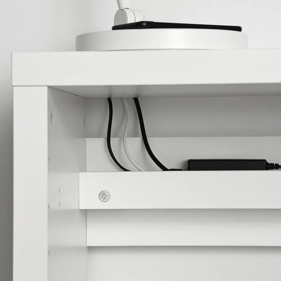 White KALLAX desk with cable outlet at the back, showcasing cable management.