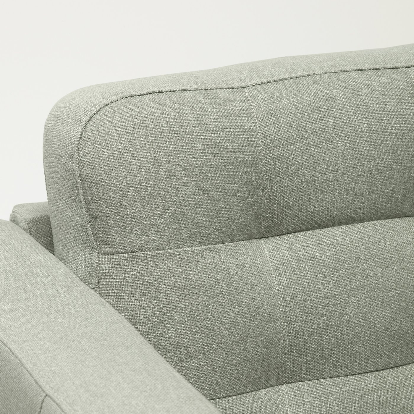 Modern armchair with sleek design. Grey fabric upholstery; clean lines. Comfortable for seating.