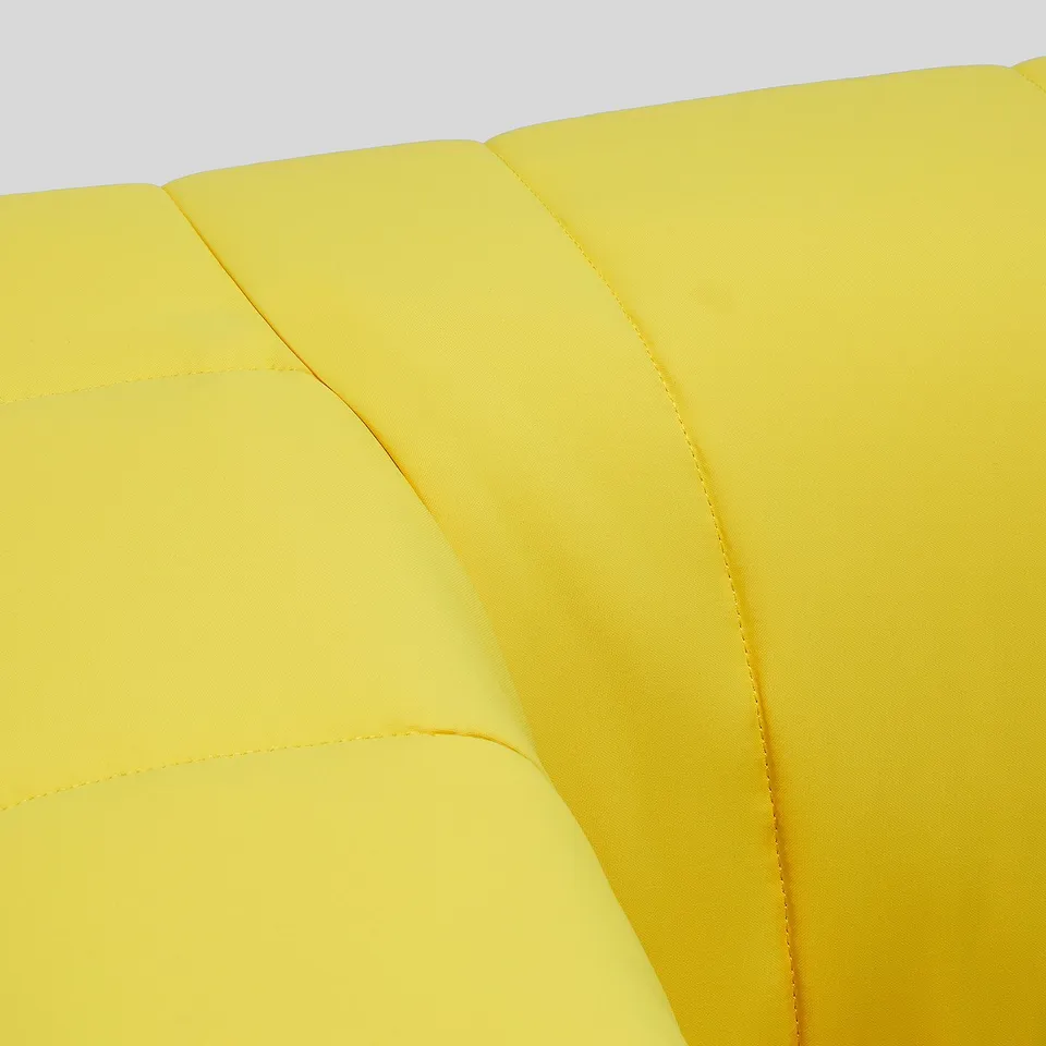 Yellow upholstered sofa/chair with smooth, stitched panels, emphasising comfort and durability.