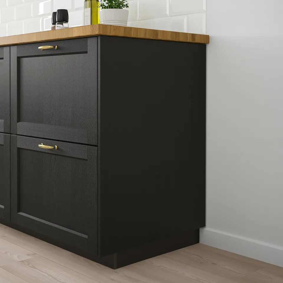 LERHYTTAN black kitchen units with gold handles; classic design, solid wood frame, modern, sleek, fits under counter, larger than surrounding items.
