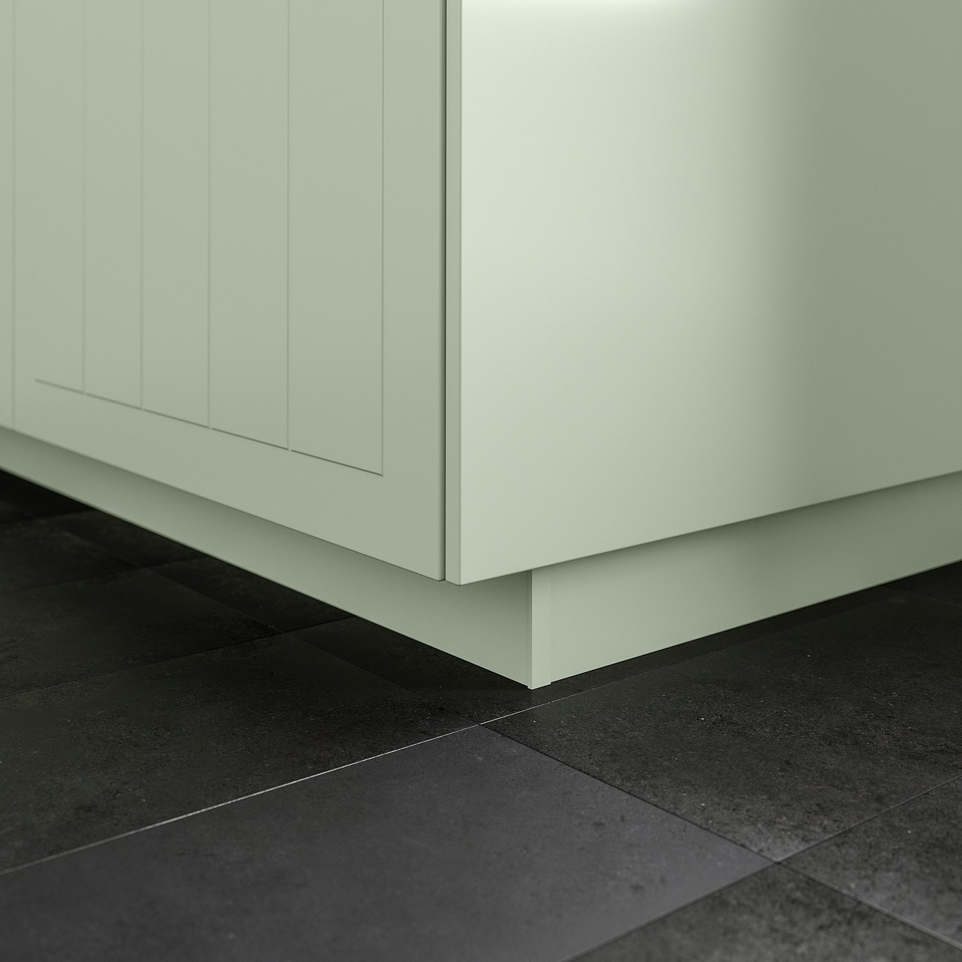 Close-up of white STENSUND plinth, filling gap between kitchen cabinet and dark floor.