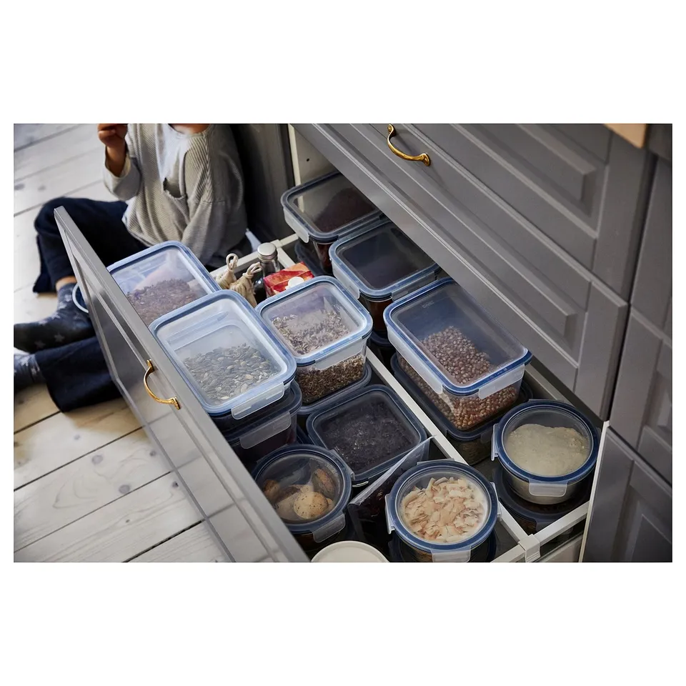 An organised kitchen drawer with matching clear plastic containers of various sizes, holding different dry foods, arranged neatly by IKEA 365+.
