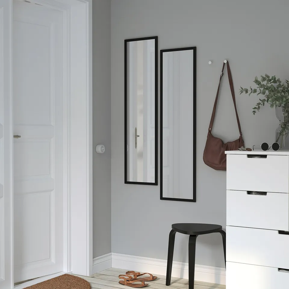Minimalist entryway with LILJETRÄD mirror, dresser, bag, plants, stool, sandals, doormat