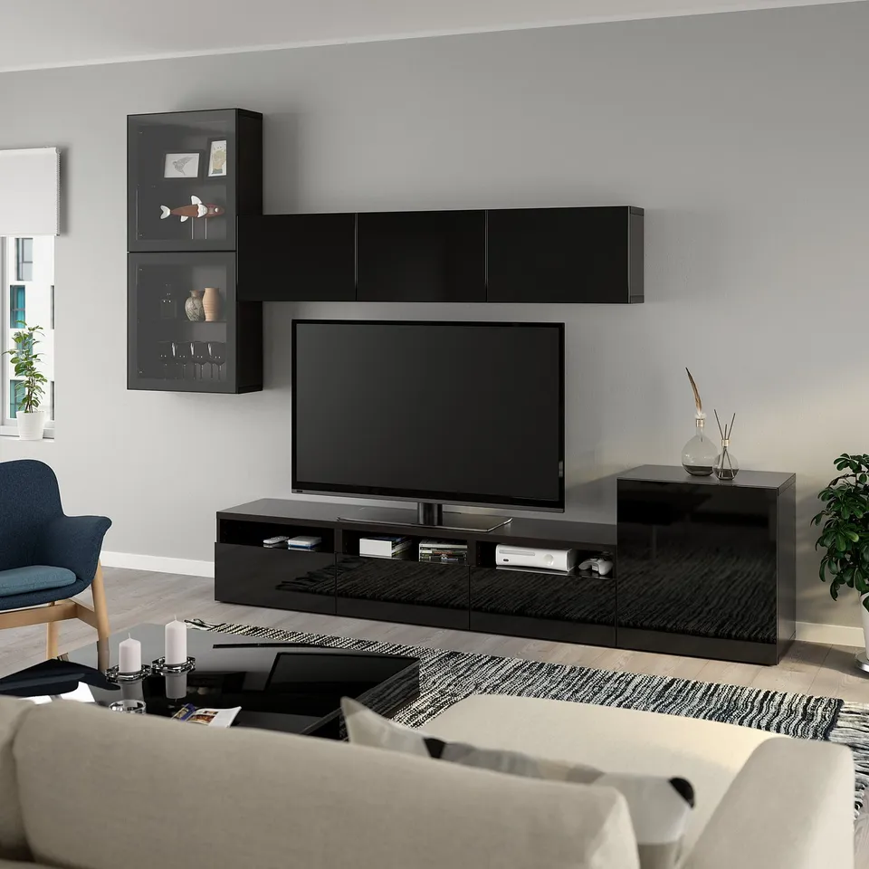 Modern living room with BESTÅ tv unit, lounge furniture, and plants.