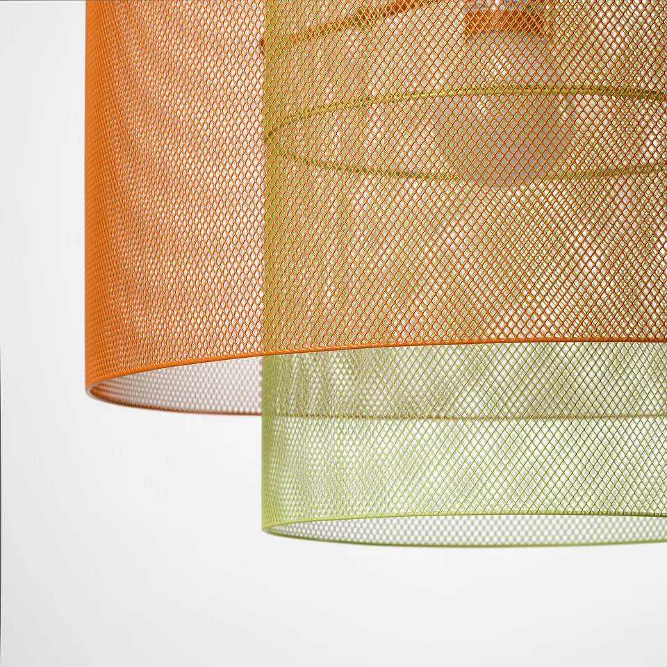 Bright cylindrical lampshades layers, orange top, green bottom, intricate mesh design.