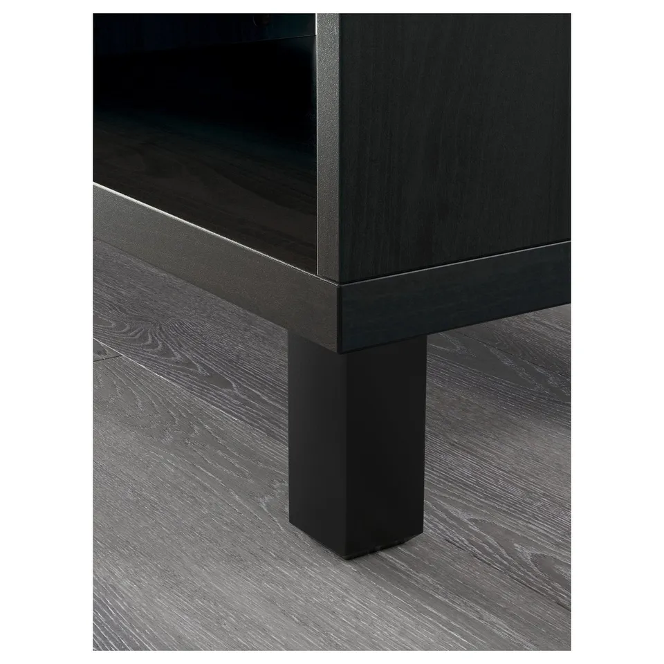 Modern black wooden furniture with sleek design. Close-up shows quality craftsmanship, smooth surfaces, and sturdy leg support.