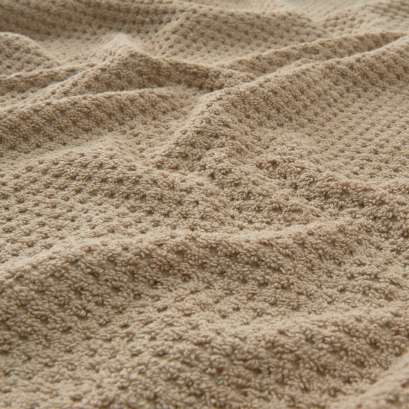 Beige cotton towel, soft and fluffy, medium thickness; 100% cotton, high quality.