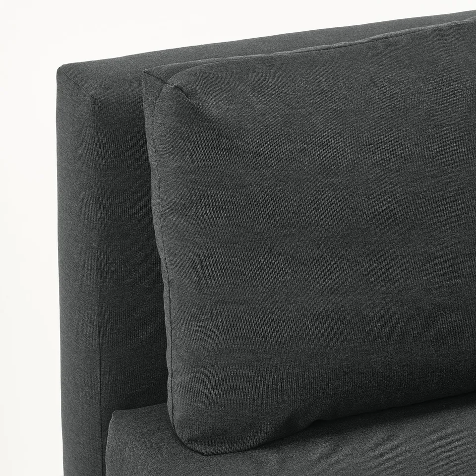 Dark grey upholstered sofa with plush, supportive cushions; showcasing quality design and comfort.