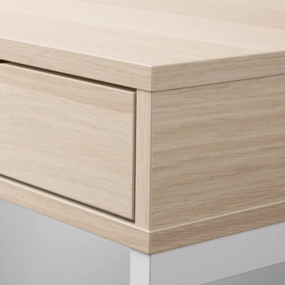 Modern wooden desk with smooth surface and sleek drawers. Shows quality craftsmanship with clean lines.