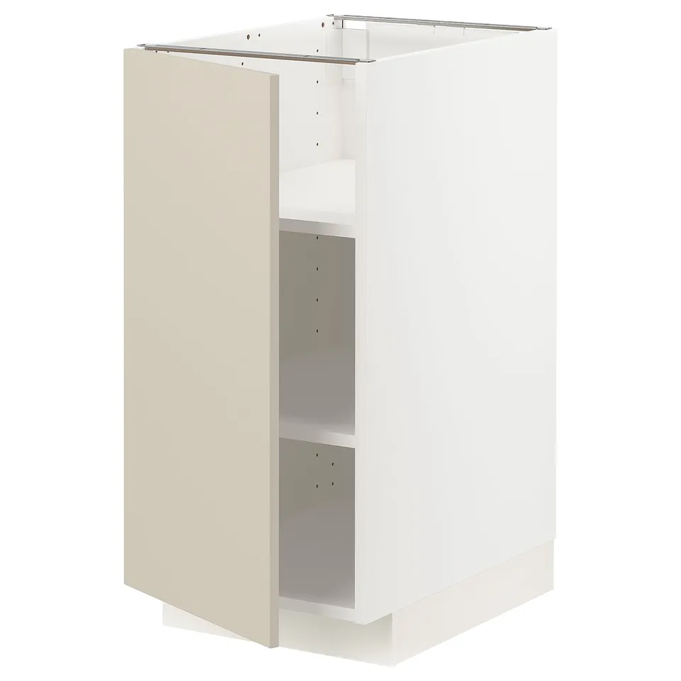 An assembled white and beige METOD kitchen cabinet. It a clean look with a smooth finish and adjustable shelves.