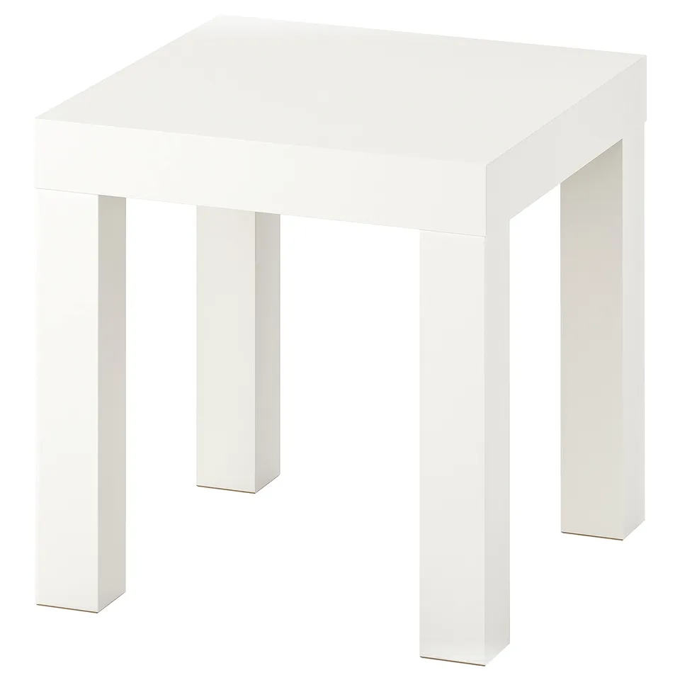 A white IKEA LACK side table. Its square-shaped, made from fibreboard and particleboard, with a minimalist design.