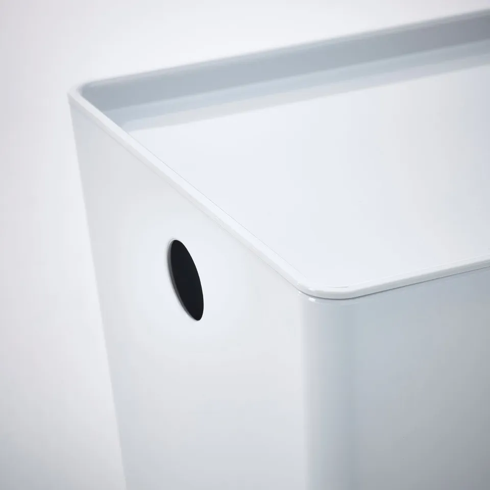White storage box with black rounded cutout handle, smooth and sleek design.