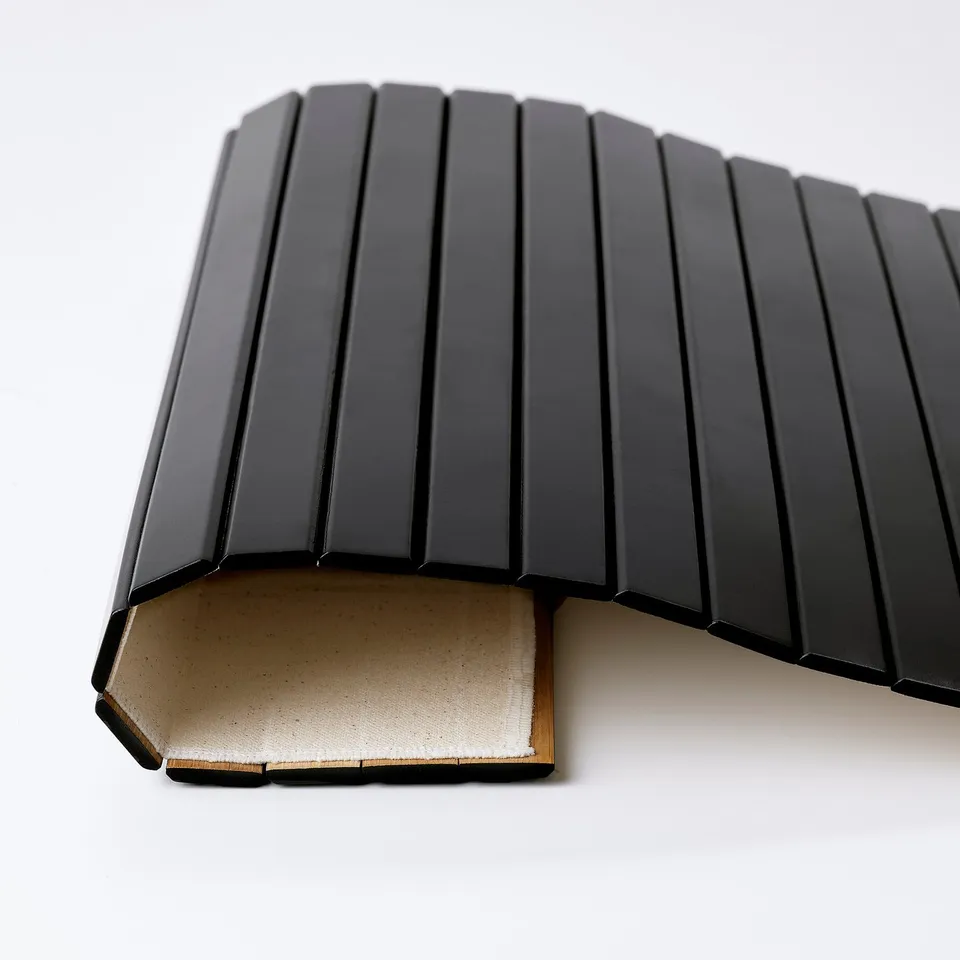 Black bamboo tray; sturdy, sleek, modern design. Ideal for snacks or drinks; fits perfectly over armrests.